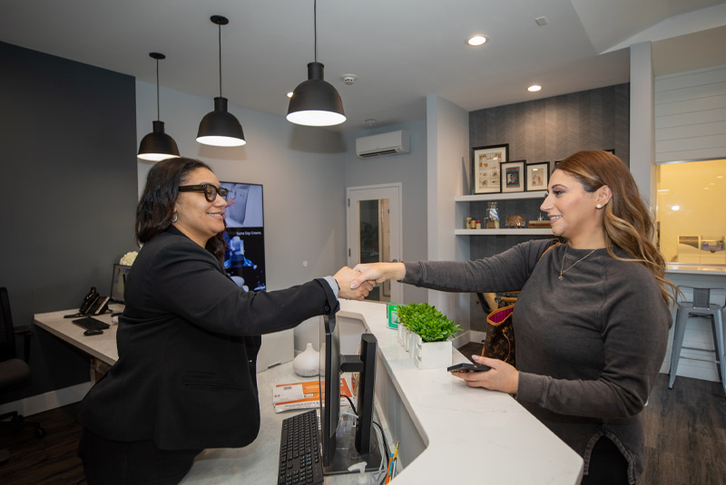 Patient and assistant shaking hands